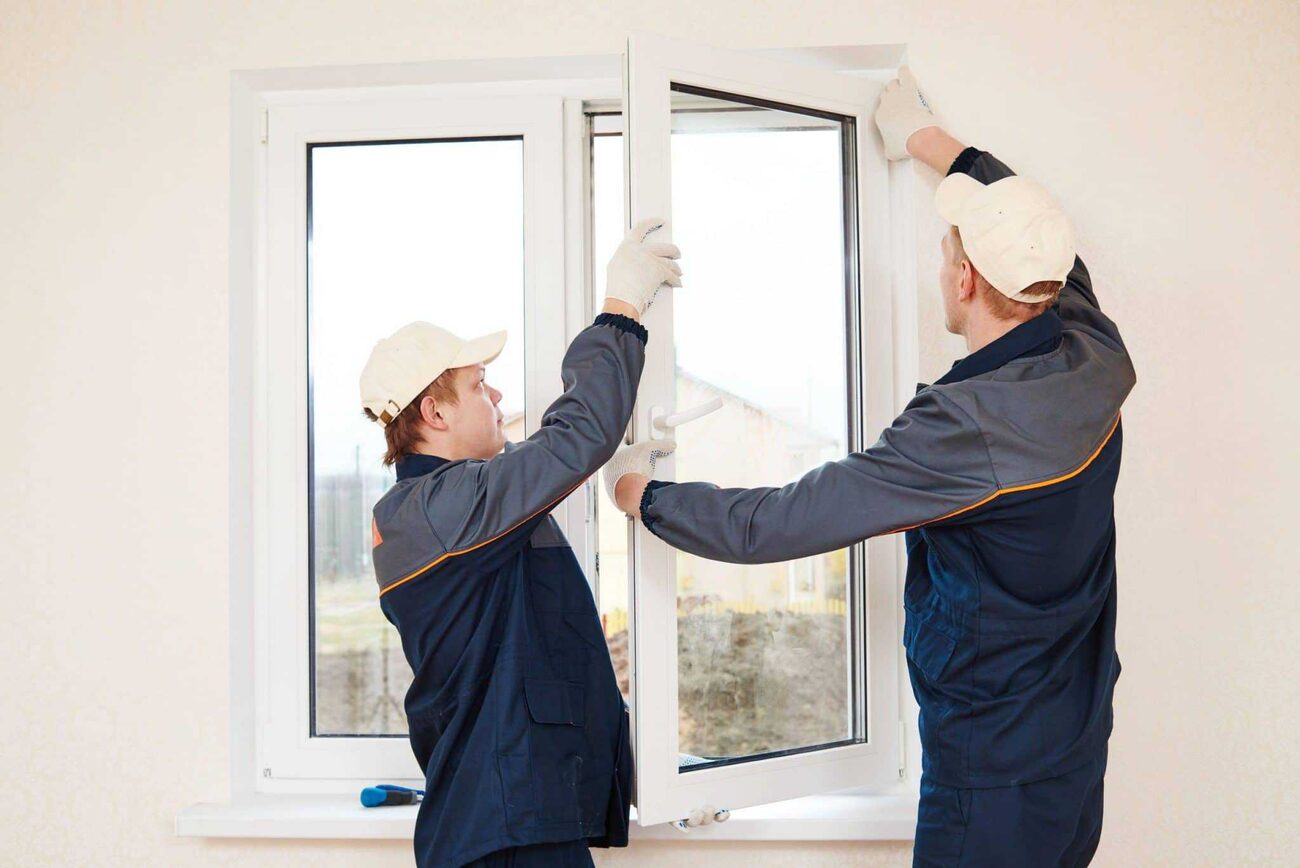 Glazier installation team replacing windows tidily